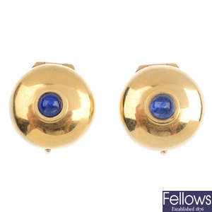 A pair of sapphire button covers.