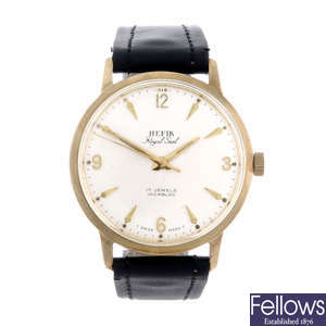 HEFIK - a gentleman's 9ct yellow gold wrist watch.