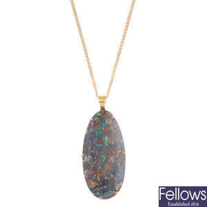 An 18ct gold boulder opal pendant, with 9ct gold chain.