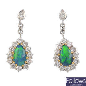 A pair of 18ct gold black opal and diamond earrings.