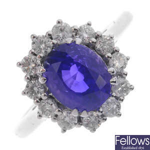 A colour change sapphire and diamond cluster ring.