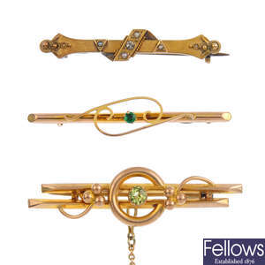 Three early 20th century gold gem-set and diamond bar brooches.