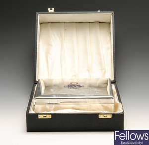 A George V silver mounted cigarette box presented by the Duke and Duchess of Connaught.