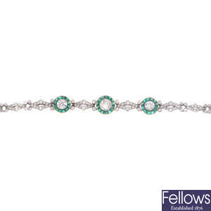 An early 20th century platinum and gold, diamond and emerald bracelet.