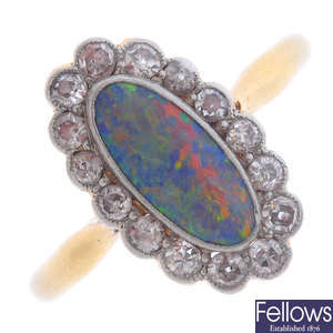 A black opal and diamond ring.