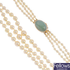 A cultured pearl three-row necklace, with jade clasp.