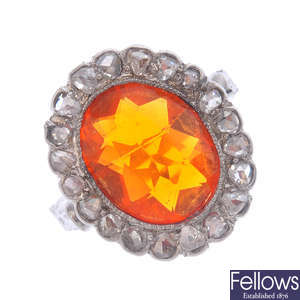 A fire opal and diamond cluster ring.