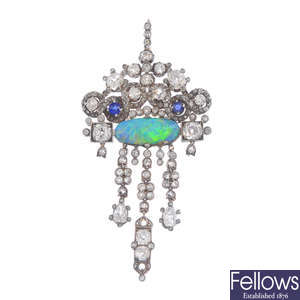 An opal, diamond and gem-set pendant.