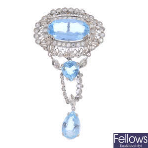 An aquamarine and diamond brooch.