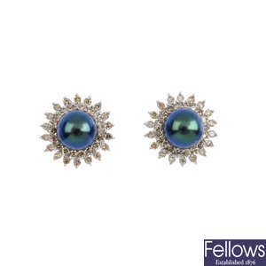 A pair of dyed cultured pearl and diamond cluster earrings.