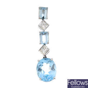 A diamond and gem-set single drop earring.