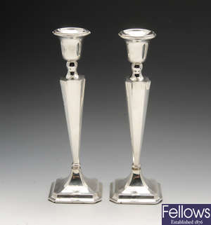 A pair of 1940's silver mounted candlesticks.