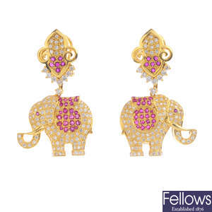 A pair of diamond and ruby elephant earrings.
