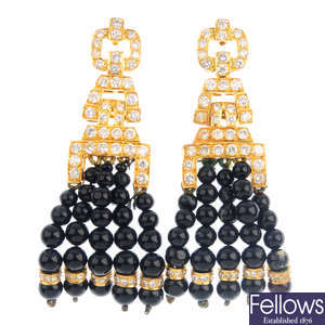 A pair of onyx and diamond earrings.