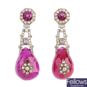 A pair of diamond and glass-filled ruby earrings.