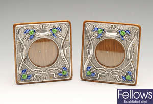 A matched pair of Art Nouveau silver mounted photograph frames.