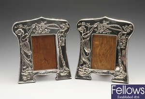 A pair of Edwardian silver mounted photograph frames.