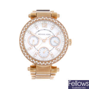 MICHAEL KORS - a lady's gold plated bracelet watch.