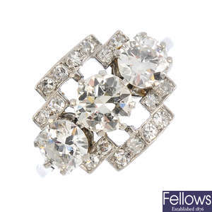 An Art Deco three stone diamond dress ring.