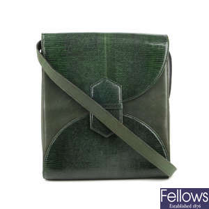 YVES SAINT LAURENT - a green handbag.