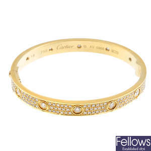 CARTIER - an 18ct gold diamond hinged 'Love' bangle.