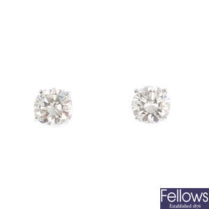 A pair of brilliant-cut diamond stud earrings, with Graff report.