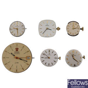 OMEGA - a group of twelve assorted watch movements.