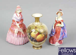 Two Royal Doulton figurines, together with two Royal Worcester bone china vases.