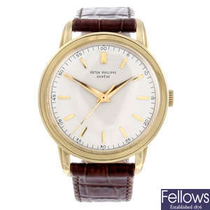 PATEK PHILIPPE - a gentleman's yellow metal Calatrava wrist watch.