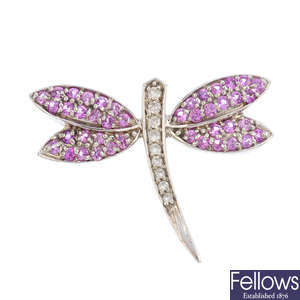 A sapphire and diamond dragon fly pin.