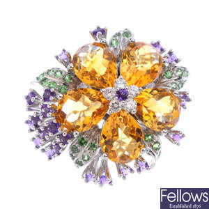 A diamond and gem-set floral dress ring.