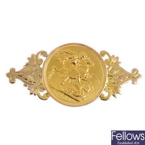 A full sovereign coin brooch.
