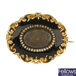A late Victorian enamel and seed pearl memorial brooch. 