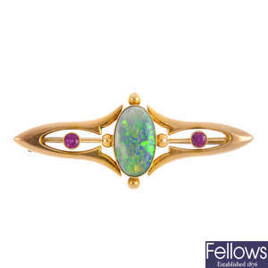 An Art Nouveau 15ct gold opal and synthetic ruby brooch.