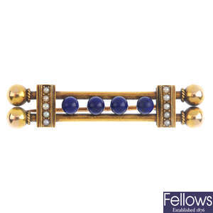 A late Victorian gold lapis lazuli and split pearl bar brooch.