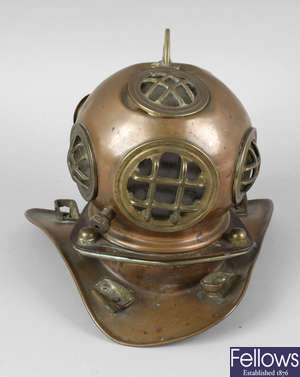 A novelty copper table lamp cover, modelled as a deep sea diving helmet.