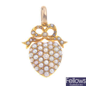 A late Victorian diamond and split pearl pendant.
