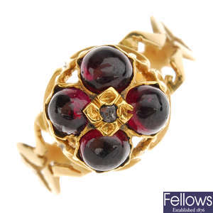An early 19th century gold garnet and diamond ring.