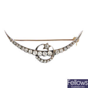 A late Victorian gold and silver diamond crescent brooch.