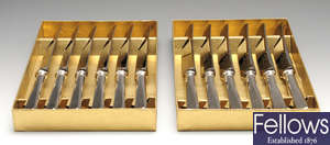 Cased modern silver handled table & side knives & an American carving set.
