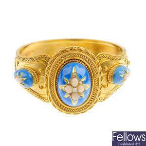 A late Victorian gold, enamel and gem-set hinged bangle.