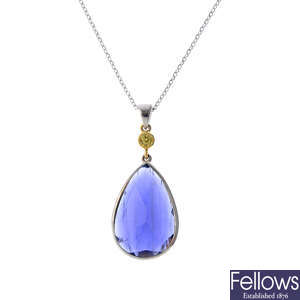 An 18ct gold iolite and sapphire pendant.