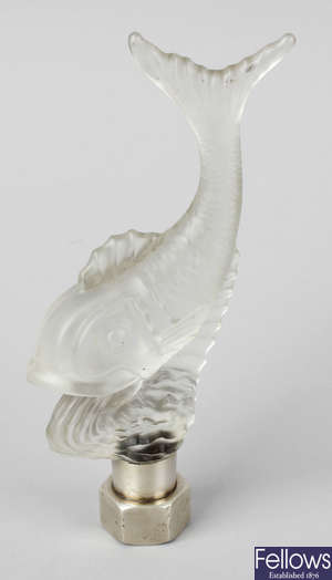 An Art Deco frosted glass ornament modelled as a fish upon a wave.