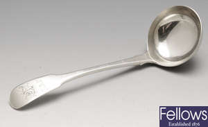 A George III silver sauce ladle and a pair of George III silver sugar tongs. (2).
