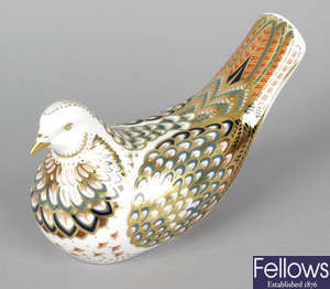 A Royal Crown Derby porcelain paperweight modelled as a dove.