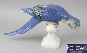 A Royal Dux porcelain figurine modelled as a parrot.
