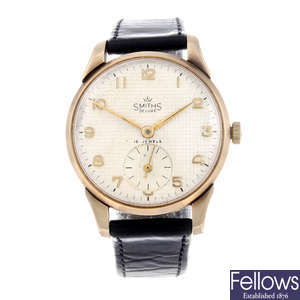 SMITHS - a gentleman's 9ct yellow gold wrist watch with 9ct gold J.W Benson watch head.