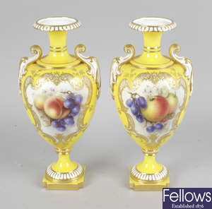 A pair of Royal Worcester bone china vases.
