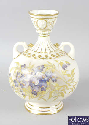 A Royal Worcester bone china twin handled globular shaped vase.