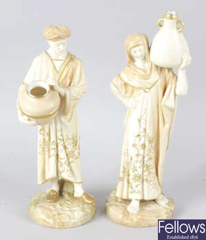 A pair of Royal Worcester bone china figurines.